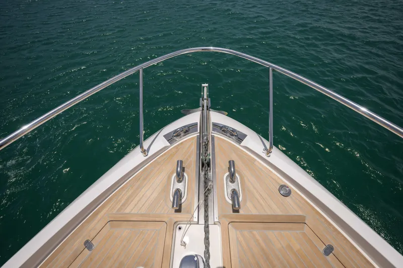 Slide: The Image of Ferretti Yachts 720 bow, 2023 model, with teak deck and stainless steel railings. - 21