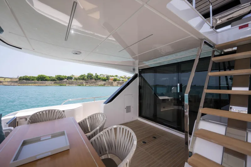 Slide: The Image of Luxurious 2023 Ferretti Yachts 720 deck with seating and ocean view. - 23