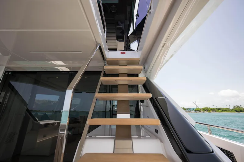Slide: The Image of Staircase on 2023 Ferretti Yachts 720, leading to upper deck with ocean view. - 24