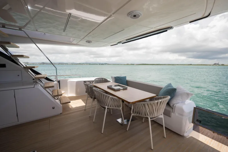 Slide: The Image of Luxurious 2023 Ferretti Yachts 720 deck with elegant seating and ocean view. - 25