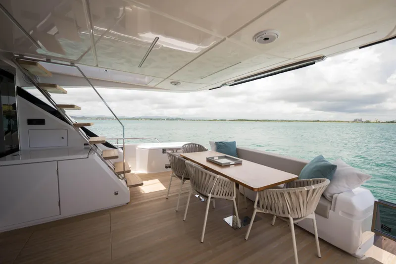 Slide: The Image of Luxurious 2023 Ferretti Yachts 720 deck with elegant seating and ocean view. - 26