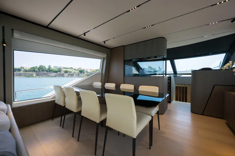 Slide: The Image of Luxurious interior of 2023 Ferretti Yachts 720 with elegant dining area and scenic views. - 31