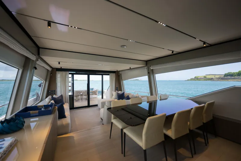 Slide: The Image of Luxurious interior of 2023 Ferretti Yachts 720 with ocean view and elegant dining area. - 32