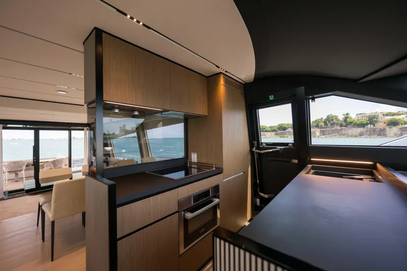 Slide: The Image of Luxurious interior of 2023 Ferretti Yachts 720 with modern kitchen and ocean view. - 36