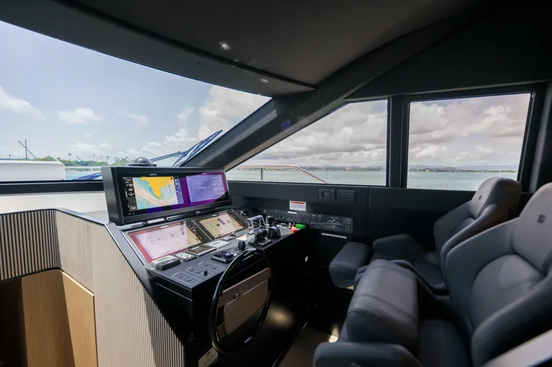 Slide: The Image of Luxurious 2023 Ferretti Yachts 720 helm with advanced navigation systems and plush seating. - 38