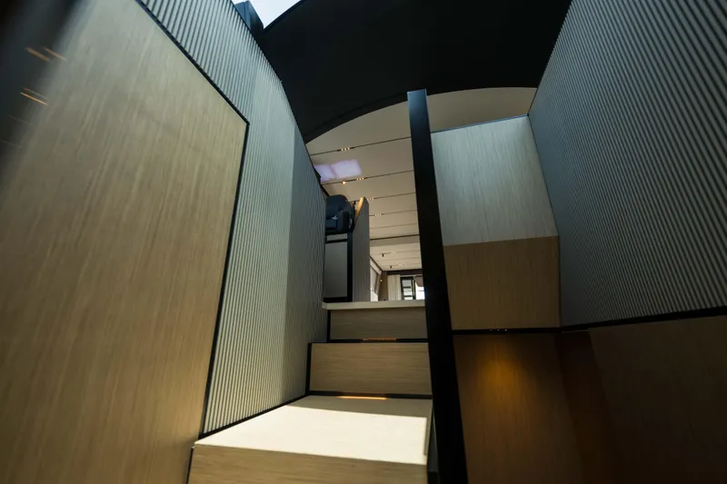 Slide: The Image of Interior staircase of 2023 Ferretti Yachts 720, featuring modern design and wood accents. - 40