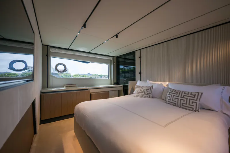Slide: The Image of Luxurious bedroom interior of 2023 Ferretti Yachts 720 with modern design and large window. - 43