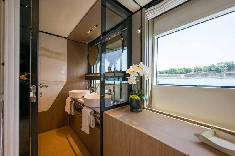 Slide: The Image of Luxurious bathroom in 2023 Ferretti Yachts 720 with modern fixtures and scenic window view. - 46