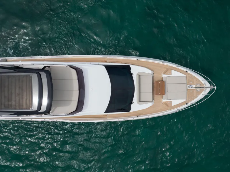 Slide: The Image of Aerial view of 2023 Ferretti Yachts 720 on turquoise water. - 5