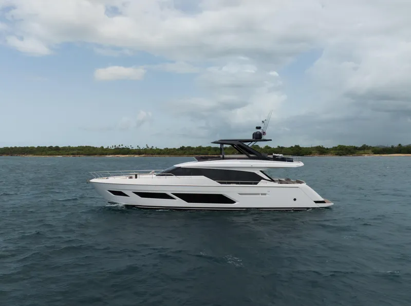 Slide: The Image of 2023 Ferretti Yachts 720 cruising on open water under cloudy skies. - 7
