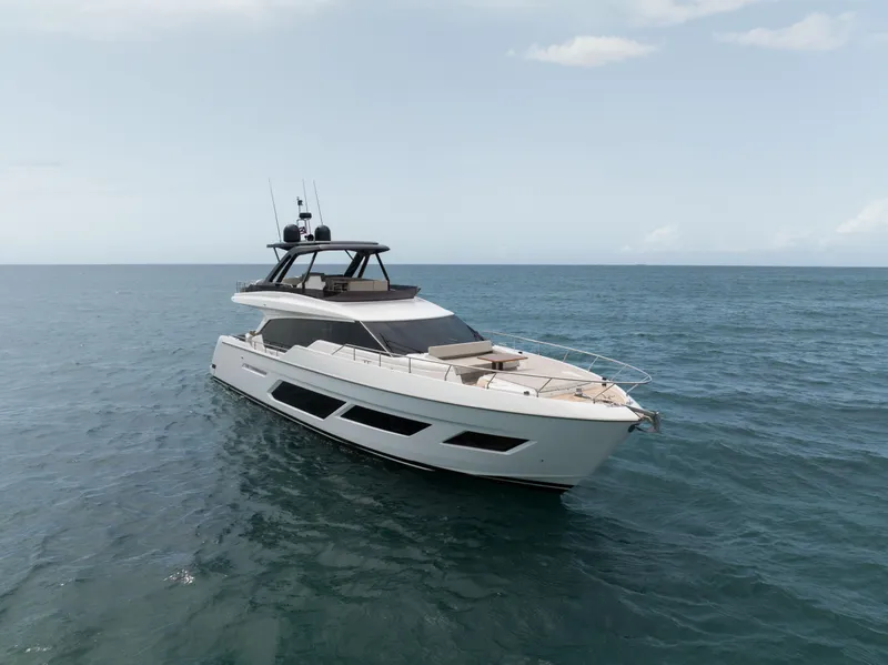 Slide: The Image of 2023 Ferretti Yachts 720 cruising on open sea under clear sky. - 9