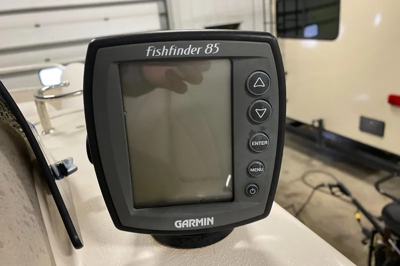 Slide: The Image of Garmin Fishfinder 85 on 2006 Premier 225 Legend boat, indoor setting. - 14
