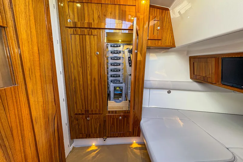 Slide: The Image of Luxurious interior of 2024 HCB 53' Suenos yacht with wood paneling and seating. - 21