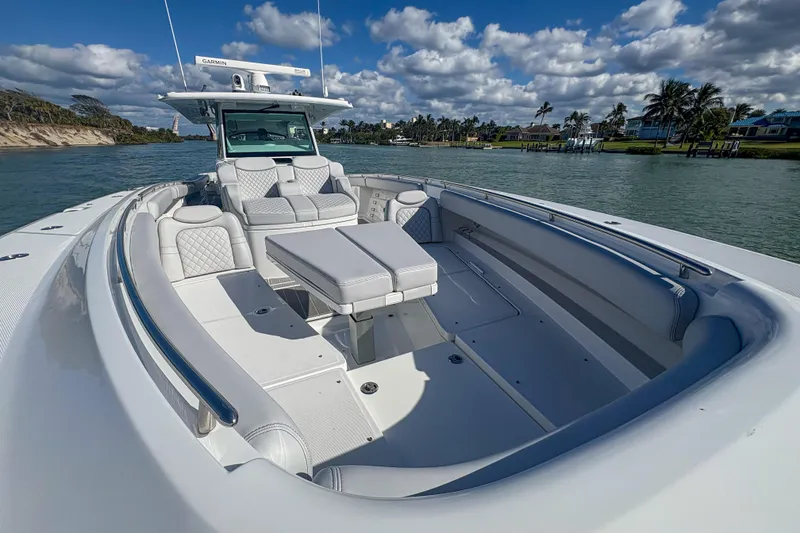 Slide: The Image of 2024 HCB 53' Suenos luxury boat with spacious seating on a sunny day. - 34