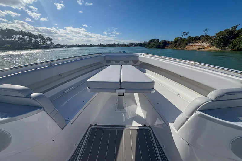 Slide: The Image of 2024 HCB 53' Suenos boat interior with seating, on a sunny day. - 35
