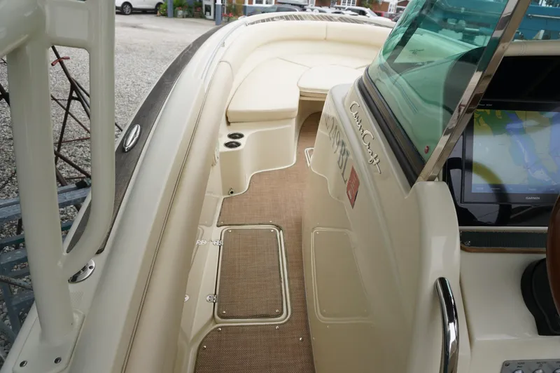 Slide: The Image of 2018 Chris-Craft Catalina 26 boat interior with seating and navigation display. - 11