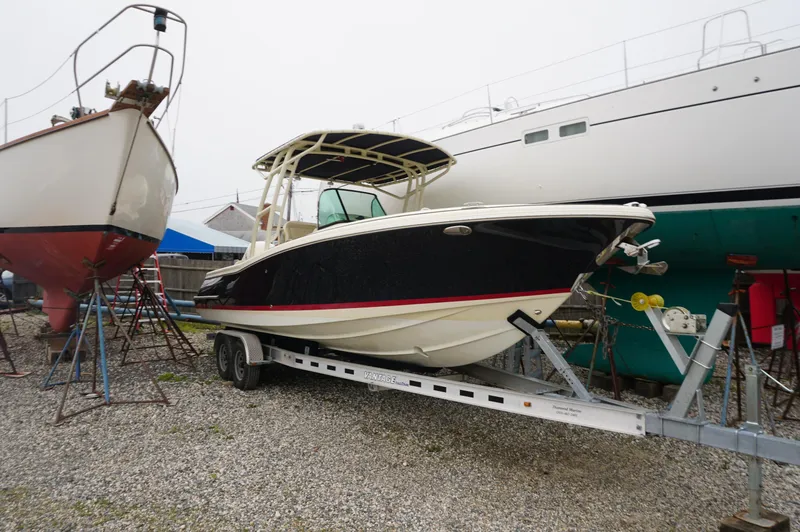 Slide: The Image of 2018 Chris-Craft Catalina 26 boat on trailer, parked in a boatyard. - 15