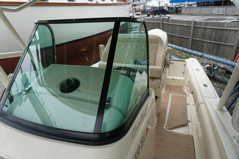 Slide: The Image of 2018 Chris-Craft Catalina 26 boat interior with windshield and seating area. - 7
