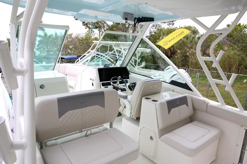 Slide: The Image of 2025 Sailfish 276 DC boat interior with modern seating and steering console. - 3
