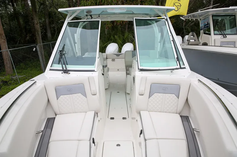 Slide: The Image of 2025 Sailfish 276 DC boat interior with white seating and modern design. - 9