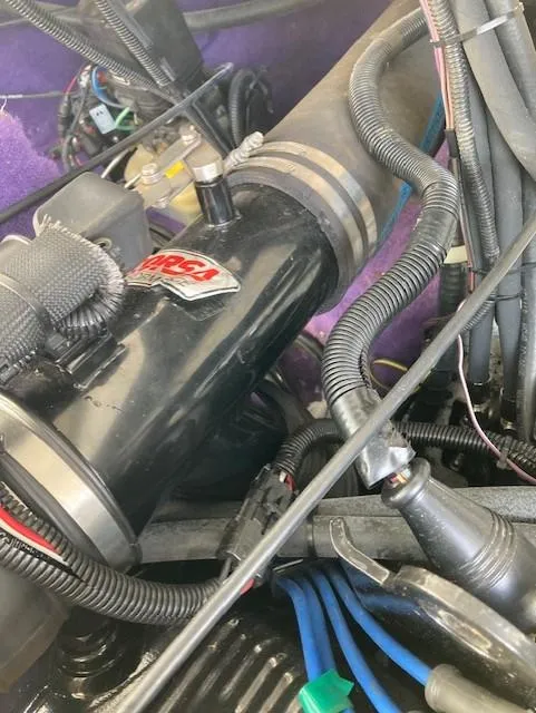 Slide: The Image of Engine compartment of a 2003 Caravelle 232 Cuddy Interceptor with visible wiring and components. - 14