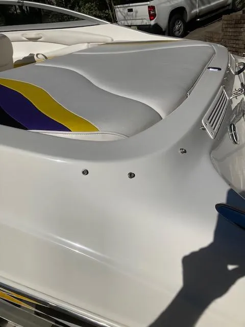 Slide: The Image of 2003 Caravelle 232 Cuddy Interceptor boat with white and colored upholstery detail. - 6