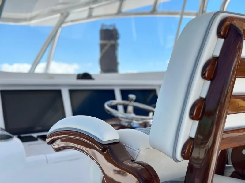 Slide: The Image of 2022 Weaver Center Console boat interior with luxurious seating and modern dashboard. - 6