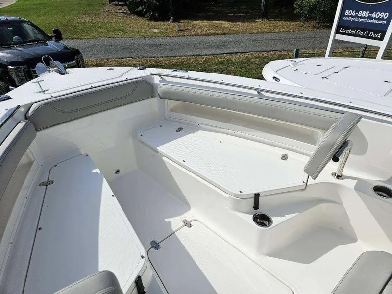 Slide: The Image of 2024 Pursuit S 248 Sport boat interior with seating and storage compartments. - 10