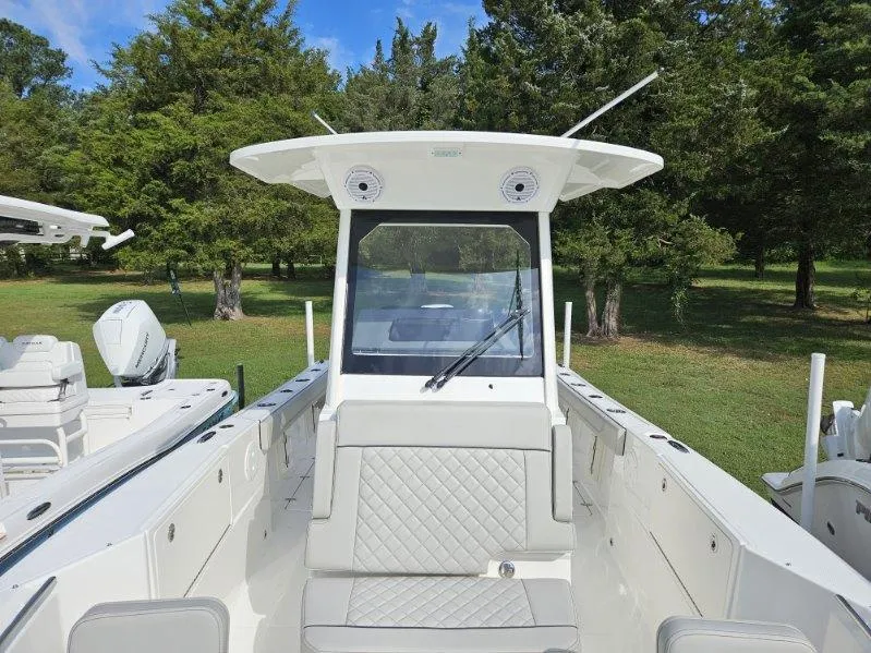 Slide: The Image of 2024 Pursuit S 248 Sport boat with sleek design, spacious seating, and modern features. - 8