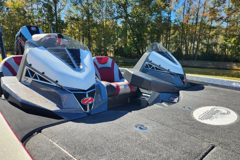 Slide: The Image of 2019 Ranger Z520L boat with sleek design, dual seats, and forest backdrop. - 10