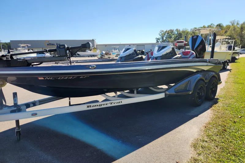 Slide: The Image of 2019 Ranger Z520L boat on trailer, parked outdoors near dealership. - 6