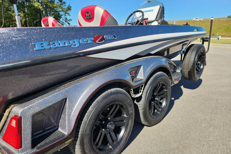 Slide: The Image of 2019 Ranger Z520L boat with dual axle trailer, metallic finish, and red-accented seats. - 7