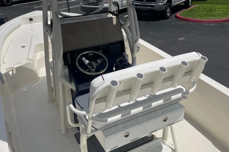Slide: The Image of 2024 Skeeter SX 2350 boat console with steering wheel and rod holders. - 11