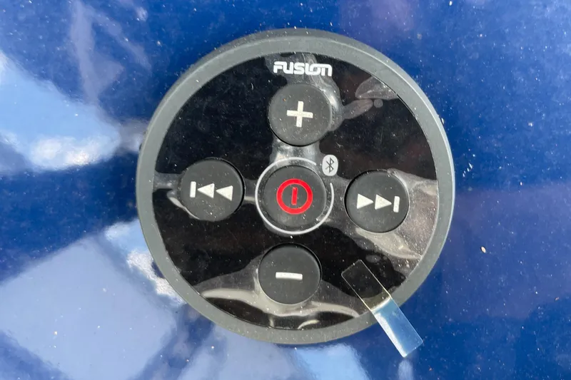 Slide: The Image of Fusion audio control panel on 2024 Skeeter SX 2350 boat. - 13