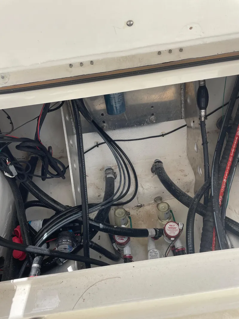 Slide: The Image of 2024 Skeeter SX 2350 boat wiring and plumbing compartment. - 17