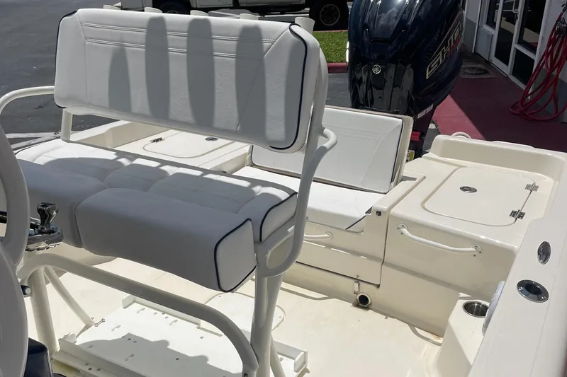 Slide: The Image of 2024 Skeeter SX 2350 boat interior with seating and engine view. - 19