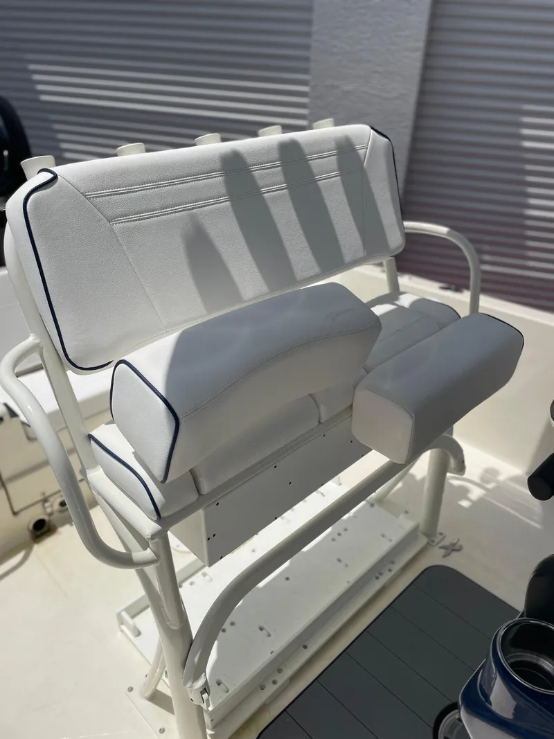 Slide: The Image of 2024 Skeeter SX 2350 boat seat with white cushioned design and sturdy frame. - 20
