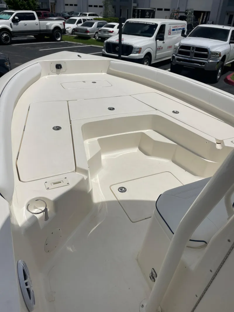Slide: The Image of 2024 Skeeter SX 2350 boat deck with storage compartments and seating. - 21