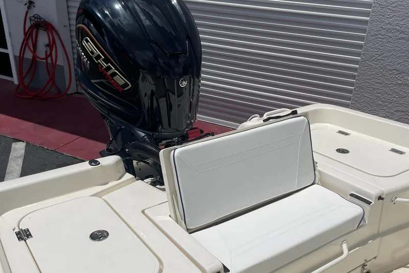 Slide: The Image of 2024 Skeeter SX 2350 boat with outboard motor and seating area. - 26
