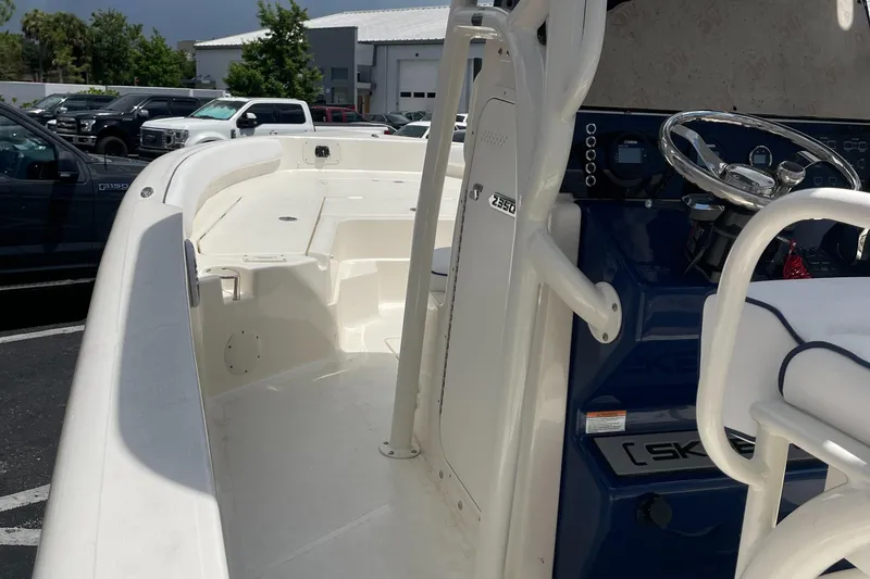 Slide: The Image of 2024 Skeeter SX 2350 boat interior with steering wheel and seating area. - 29