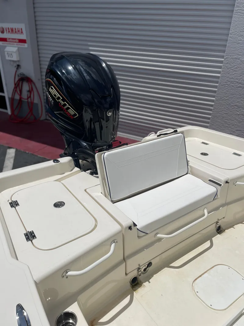 Slide: The Image of 2024 Skeeter SX 2350 boat with Yamaha outboard motor, featuring white seating and storage compartments. - 4