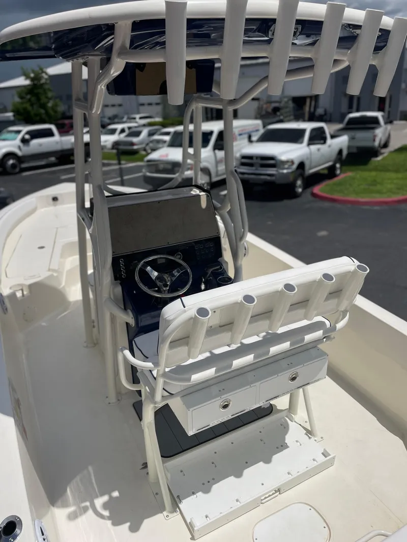 Slide: The Image of 2024 Skeeter SX 2350 boat interior with steering console and seating. - 5