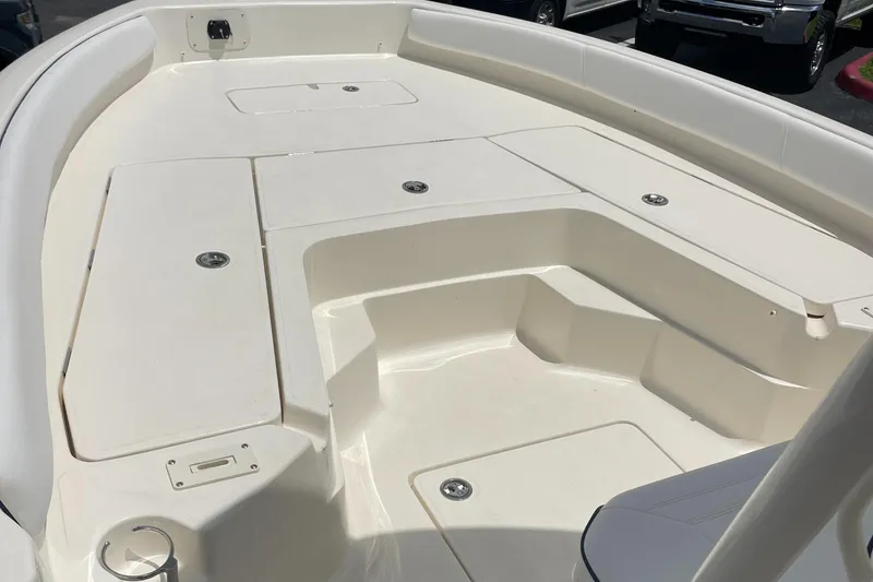 Slide: The Image of 2024 Skeeter SX 2350 boat deck with storage compartments and seating area. - 7