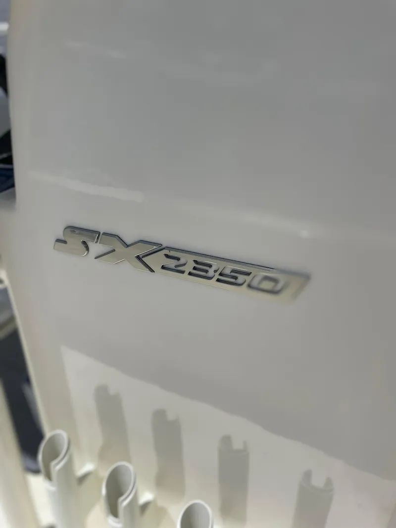 Slide: The Image of 2024 Skeeter SX 2350 boat model emblem on white surface. - 8