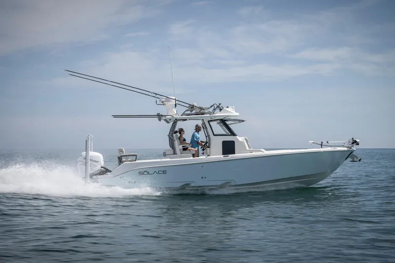 Slide: The Image of 2025 Solace 30 HCS boat cruising on open water. - 3