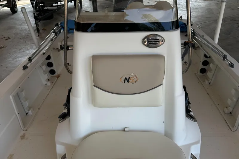 Slide: The Image of 2018 Excel 220 Bay Pro boat interior with console and seating. - 10