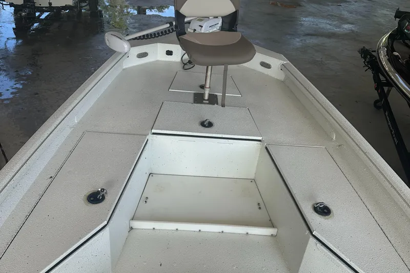 Slide: The Image of 2018 Excel 220 Bay Pro boat interior with seating and storage compartments. - 3