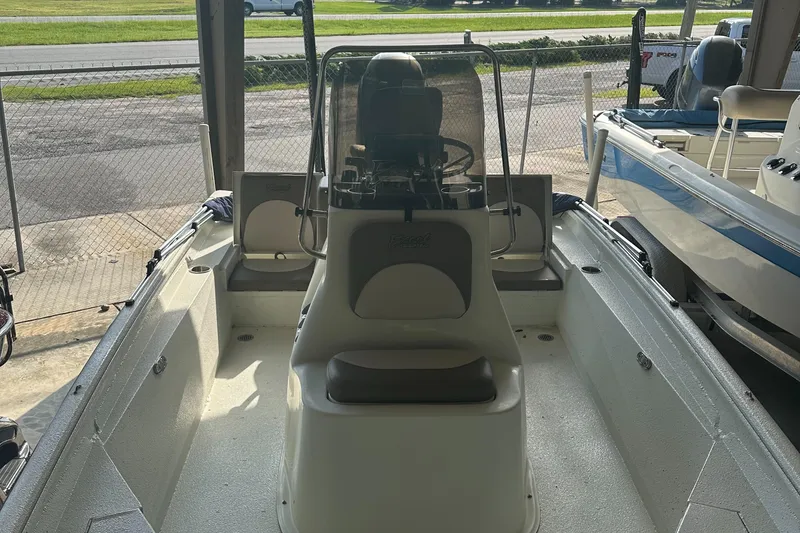 Slide: The Image of 2018 Excel 220 Bay Pro boat interior with console and seating. - 4