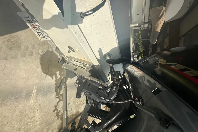 Slide: The Image of Close-up of 2018 Excel 220 Bay Pro boat motor and trailer components. - 6