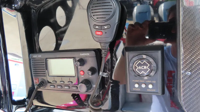 Slide: The Image of Control panel of 2014 Sunsation 34 CCX with Garmin VHF radio and ACR device. - 13